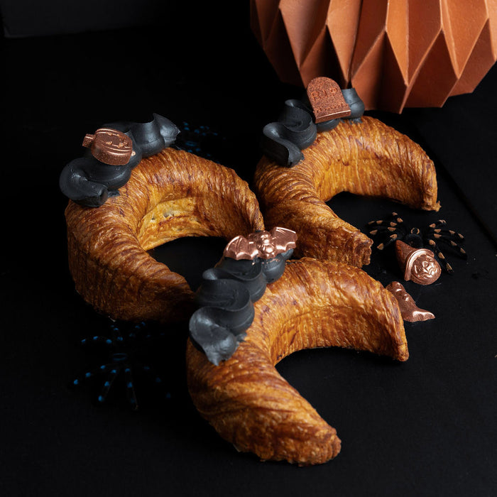 best halloween-themed food in vancouver, bc, specialty moon-shaped croissant chocolate and raspberry flavour from Chez Christophe Patisserie in burnaby, white rock, West Vancouver. 