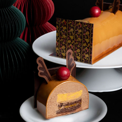 A chocolate mango Buche de Noel Christmas dessert cake from cake shop Chez Christophe in Burnaby and White Rock